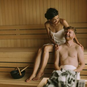 young couple relaxing sauna web